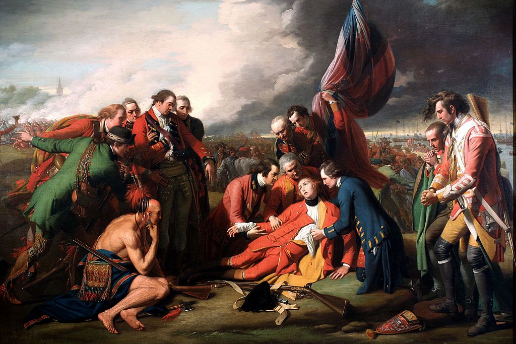 Painting of a dozen men looking over a man who lies injured on a battlefield. Hundreds of soldiers mill in the background.