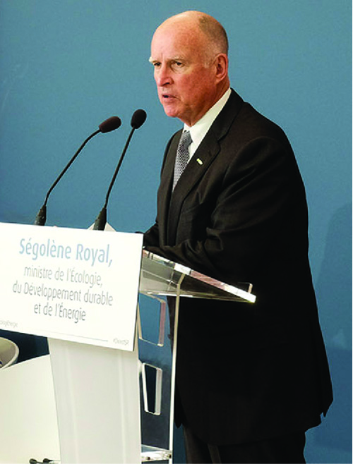 A photograph of Jerry Brown speaking from a podium.