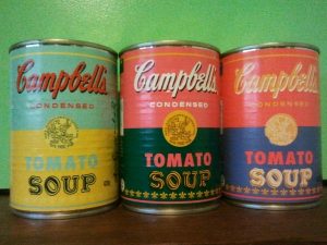 Three retro Campbell's tomato soup cans.