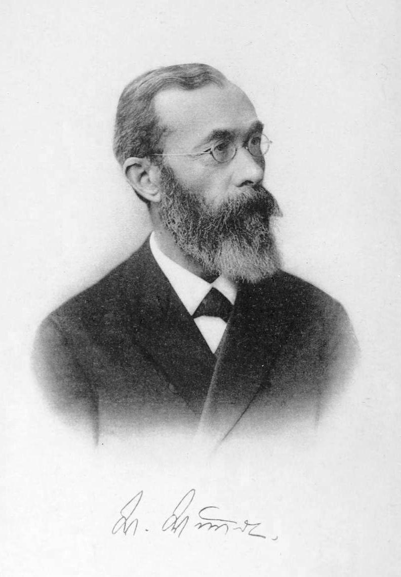 Portrait of Wilhelm Wundt, a middle-aged man with a beard wearing spectacles and a suit. 