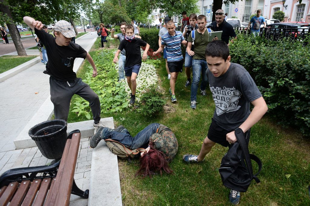 LGBT activists are attacked during an action "Day of Kisses" against a homophobic bill in Moscow