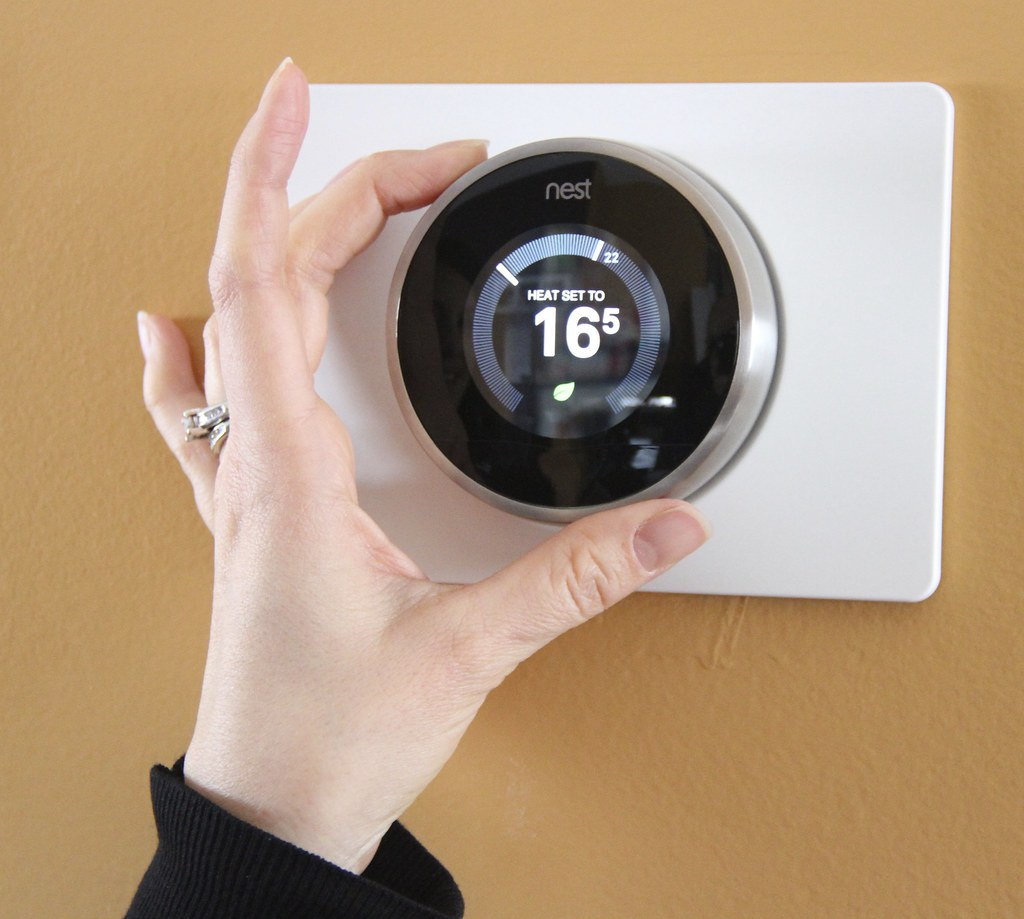 a smart thermostat with a digital temperature reading. Section discusses home appliances that can now be programmable