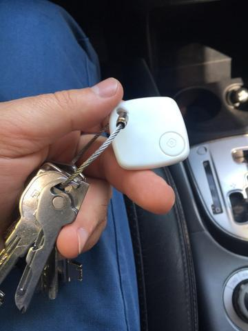 Picture of a small plastic block, about the size of a thumbnail, connected to key ring, that a Bluetooth app could find if keys are lost