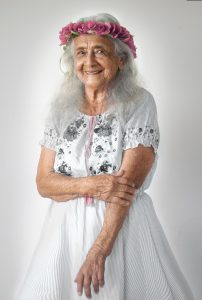 A grandmother with grey hair and brown eyes
